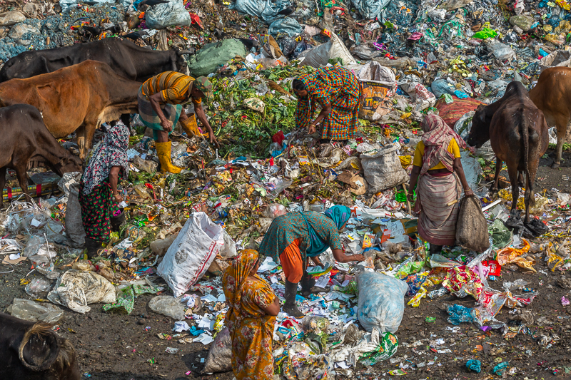 Parents sift through piles of garbage without rest, working hard to earn just enough money to provide food for their children